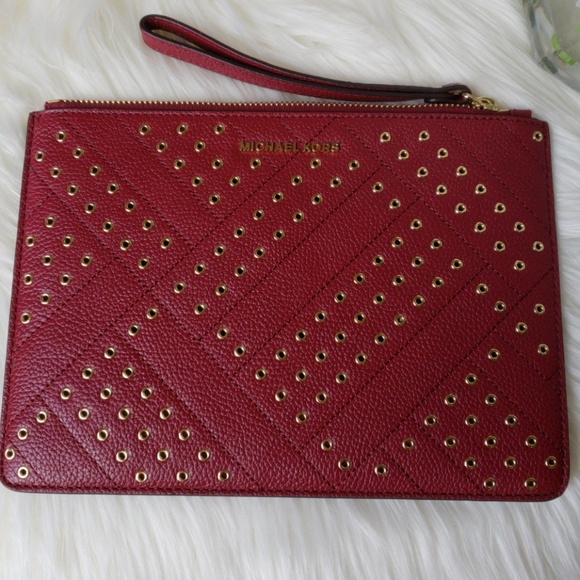 Michael Kors Handbags - Michael Kors Jet Set Travel XL Zip Clutch Mulberry